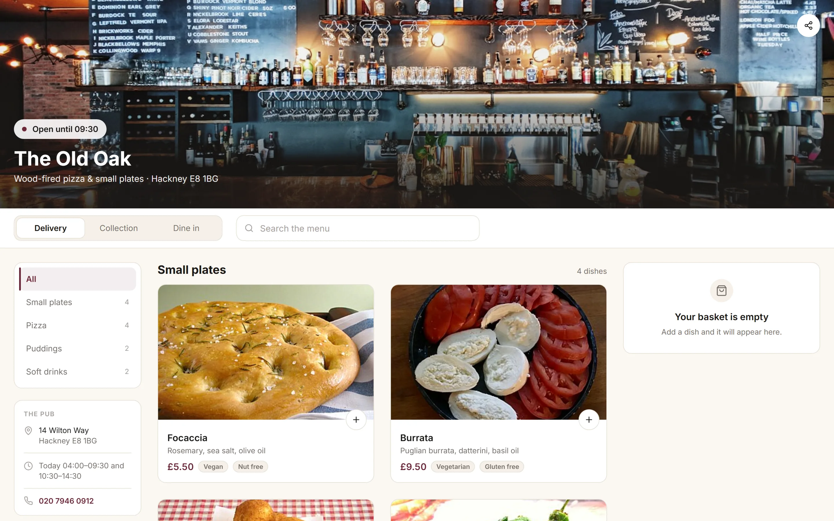 The Old Oak’s storefront: the menu with photographs, a basket and delivery, collection or dine in